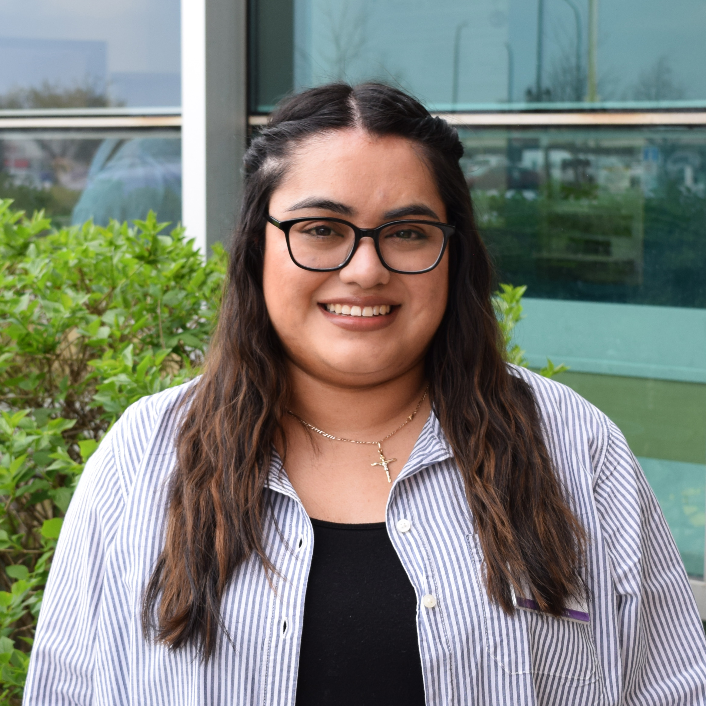 Social Services Librarian Yesenia smiling in her headshot