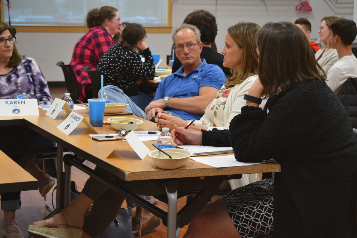 Photo of patrons in the Large Meeting Room having conversations