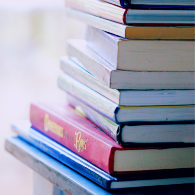 Photo of books stacked on table