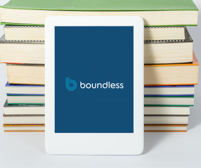 Stock photo. Tablet resting against a stack of books displaying the Boundless logo.