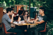 English Conversation Groups - 3 people chatting at a table