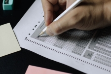 Exam Proctoring- person completing scantron