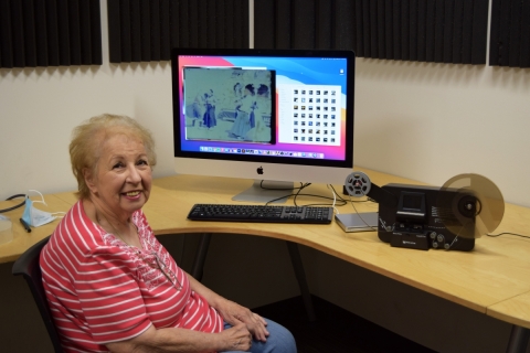 Local resident, Rose Falcone, sitting at the iMac in the Creative Studio.