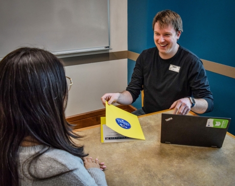 One-on-One Appointments image showing a male librarian smiling with a female patron during an appointment