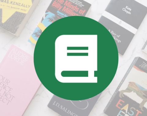 white icon of novel on green circle